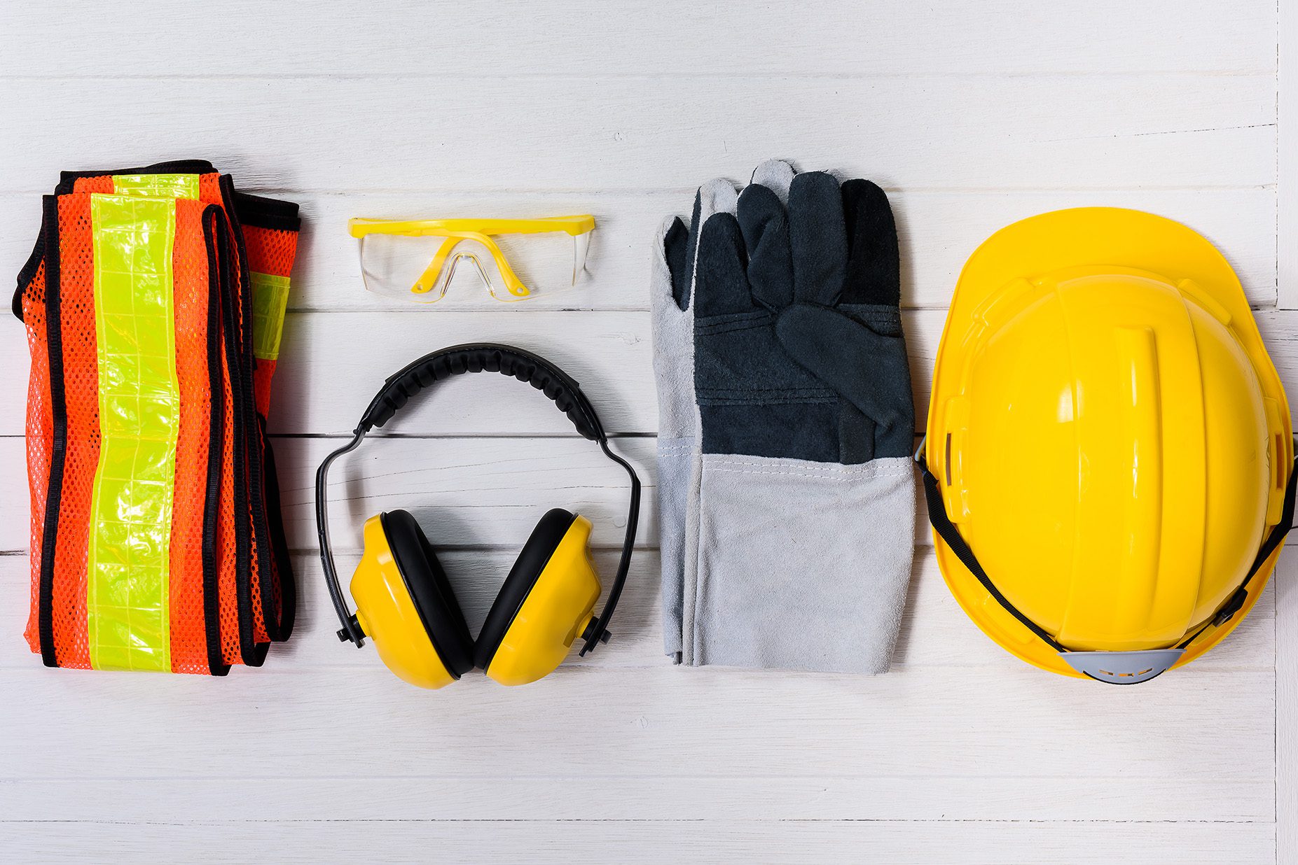 Safety gear laid out on white panels